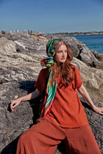 Load image into Gallery viewer, Bosphorus scarf from Istanbul Collection reimagines the beauty of Istanbul with the iconic Galata Tower and mesmerizing city skyline, with soothing shades of red, gold, blue, and green. A wearable piece of art with contemporary and fractal patterns.