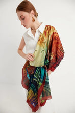 Load image into Gallery viewer, Bosphorus scarf from Istanbul Collection reimagines the beauty of Istanbul with the iconic Galata Tower and mesmerizing city skyline, with soothing shades of red, gold, blue, and green. A wearable piece of art with contemporary and fractal patterns.
