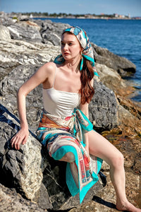 FAD Astrology-Themed Cotton Voile Bandana from Mythology Collection. With intricate fractal patterns inspired by archeological signs, this luxurious modern scarf features vibrant colors, is handstitched on edges and printed on highest-quality fabric.