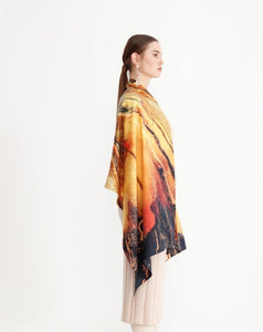 FLAME Collection 27"x78" Large Silk Shawl pays tribute to the intertwined nature of fire - growing and evolving, by this elongated design of intersecting colours of flame and heat. Produced in limited numbers, hand-rolled on edges and hand stitched.