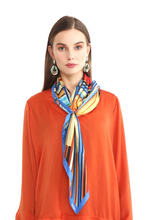 Charger l&#39;image dans la galerie, FLAME Collection 35&quot;x35&quot; Silk Scarf pays tribute to the intertwined nature of fire - growing and evolving, by this elongated design of intersecting colours of flame and heat. Produced in limited numbers, hand-rolled on edges and hand stitched.
