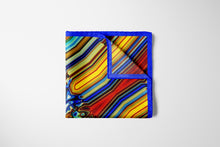 Charger l&#39;image dans la galerie, FLAME Collection 35&quot;x35&quot; Silk Scarf pays tribute to the intertwined nature of fire - growing and evolving, by this elongated design of intersecting colours of flame and heat. Produced in limited numbers, hand-rolled on edges and hand stitched.
