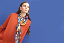 Charger l&#39;image dans la galerie, FLAME Collection 35&quot;x35&quot; Silk Scarf pays tribute to the intertwined nature of fire - growing and evolving, by this elongated design of intersecting colours of flame and heat. Produced in limited numbers, hand-rolled on edges and hand stitched.
