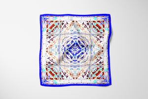 Silk Scarf 35" x 35" hand-stitched on edges - MARE Collection Inspired by the many treasures of the ocean, MARE cotton silk large scarf has beautiful notes of blue and coral reds in fractal forms creating waves of motion.