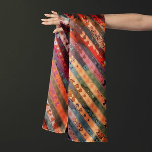 100% Silk Twill Shawl, FLAME Collection Designed with fractal formulas creating diagonal stripes with tones of red, blue green and yellow. An exclusive piece of accessory - a scarf, a foulard.. Limited edition, hand-rolled on edges and hand stitched.