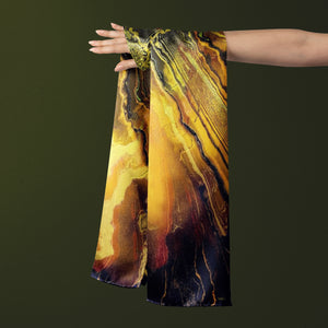 FLAME Collection 27"x78" Large Silk Shawl pays tribute to the intertwined nature of fire - growing and evolving, by this elongated design of intersecting colours of flame and heat. Produced in limited numbers, hand-rolled on edges and hand stitched.