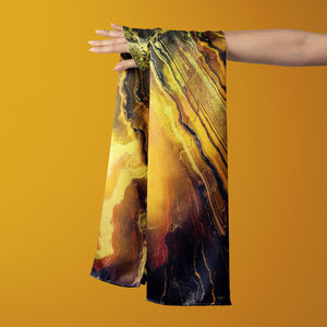 FLAME Collection 27"x78" Large Silk Shawl pays tribute to the intertwined nature of fire - growing and evolving, by this elongated design of intersecting colours of flame and heat. Produced in limited numbers, hand-rolled on edges and hand stitched.